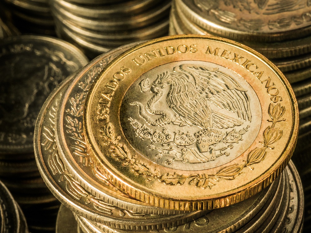 a stack of mexican gold coins